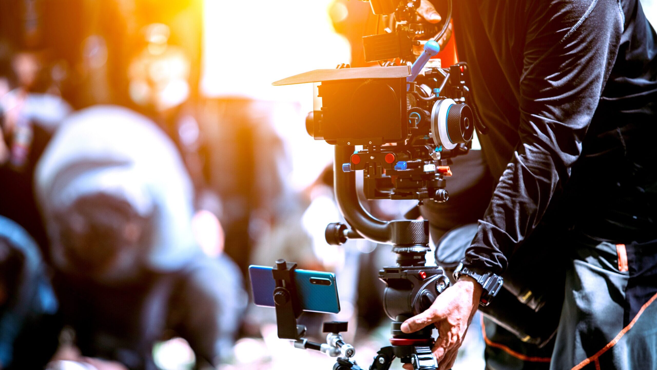 Blogger or content creator cameraman operating camera shooting cinematography